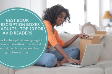 An excited woman sitting on a couch opening her book subscription box and looking at her laptop.