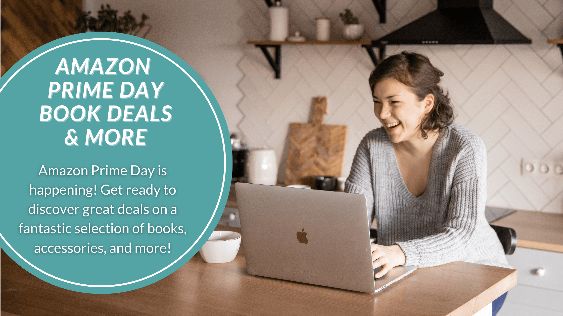Woman smiling in front of her laptop because she's getting great Amazon Prime Day deals on books and more.
